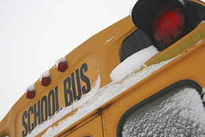 back of a school bus covered in snow