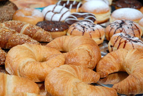 an assortment of croissants and donuts